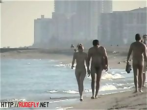 peeping at a red-hot naturist couple on the beach
